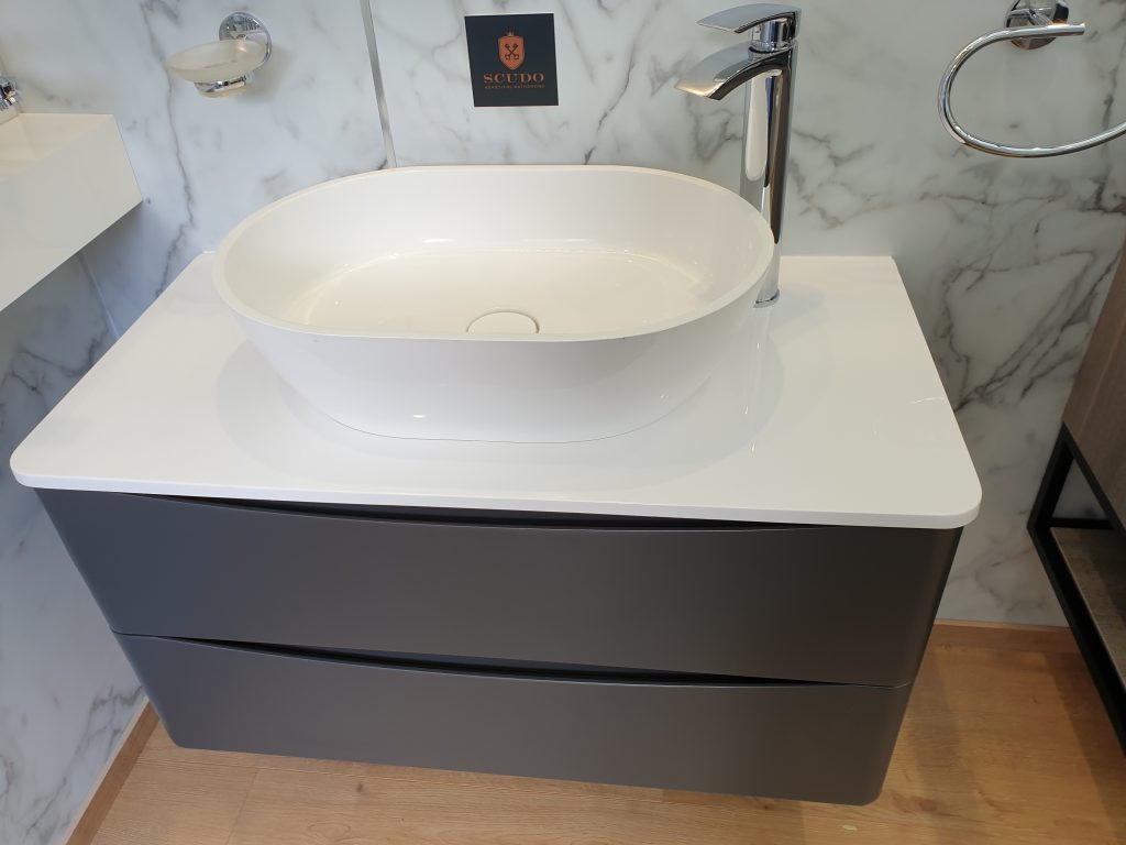 A sink and cabinet in the travelling bathroom showroom